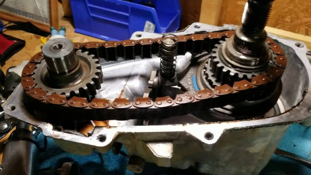 Loosely attached transfer case chains
